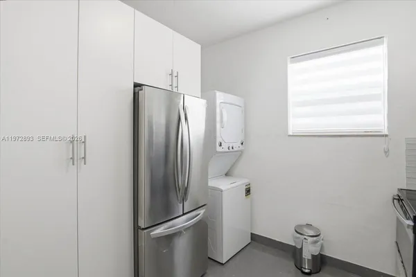 a view of water heater room with a door