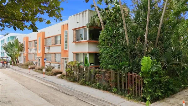 front view of a house with a tree