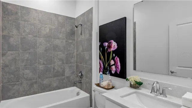 a bathroom with a tub and shower curtain