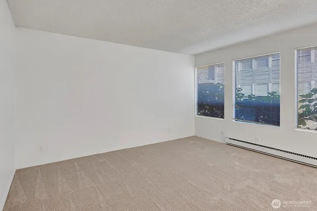 a view of an empty room with glass door