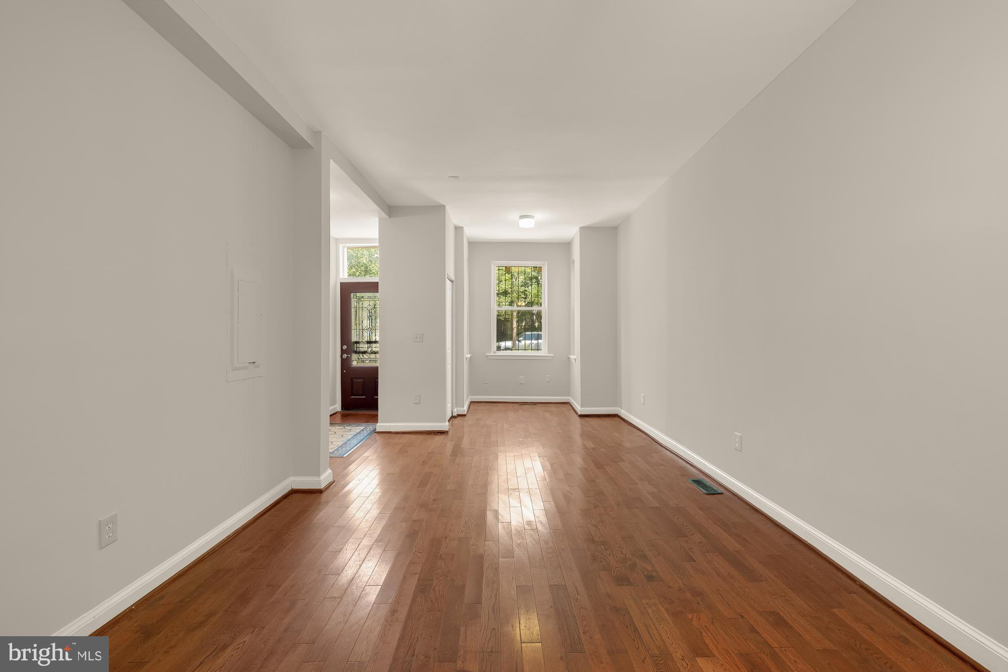 601 L Street Northeast Washington, DC 20002 - Photo 11 of 47 an empty room with wooden floor and windows