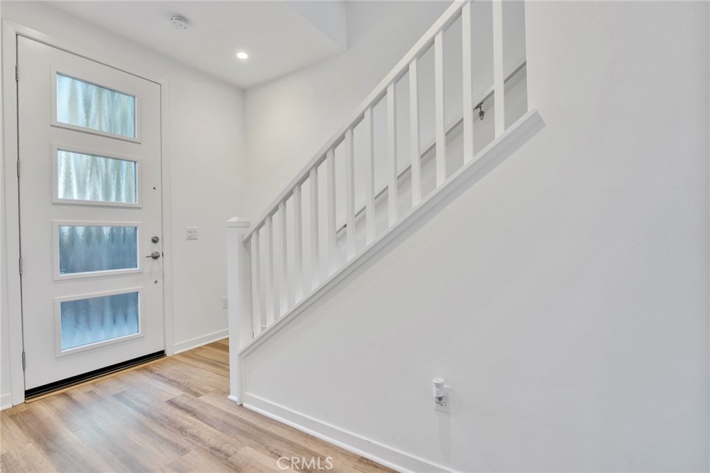 105 Schick Irvine, CA 92614 - Photo 13 of 39 a view of entryway and hall with wooden floor