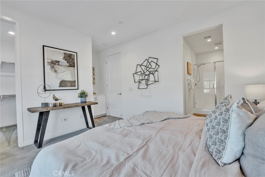 105 Schick Irvine, CA 92614 - Photo 15 of 39 a bedroom with a bed and a table in it