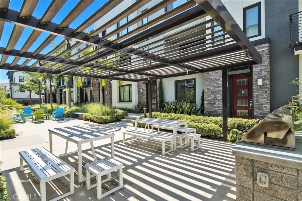 105 Schick Irvine, CA 92614 - Photo 34 of 39 a view of a patio with table and chairs and potted plants