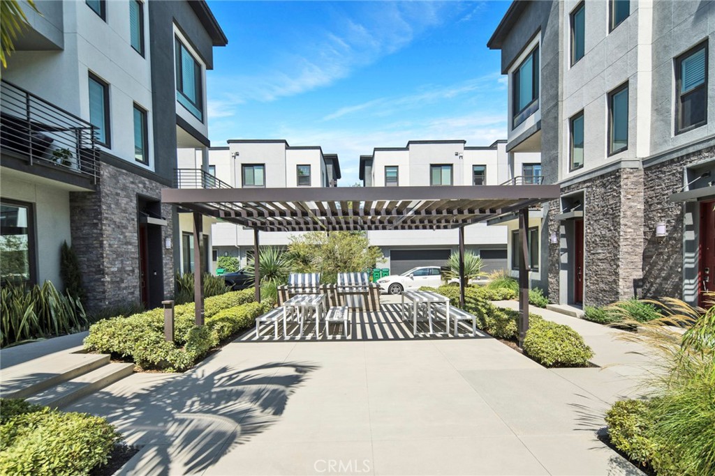 105 Schick Irvine, CA 92614 - Photo 36 of 39 a view of a building with garden from a patio
