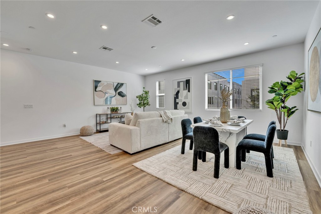 105 Schick Irvine, CA 92614 - Photo 9 of 39 a living room with furniture and a wooden floor