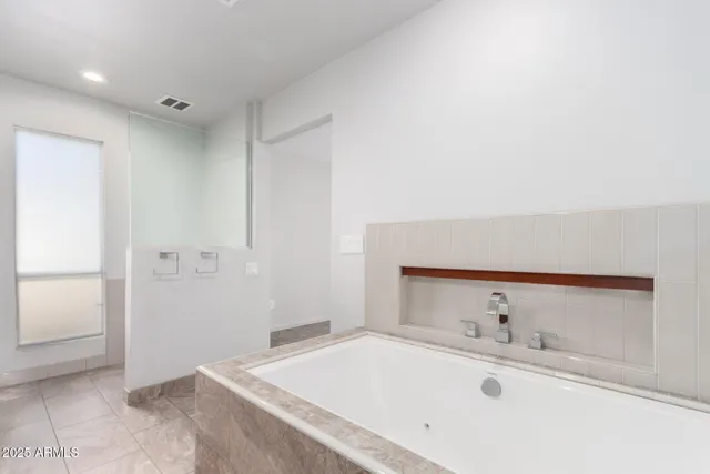 a bathroom with a sink and a bathtub