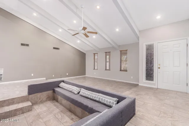 a spacious bathroom with a large tub shower and bedroom view