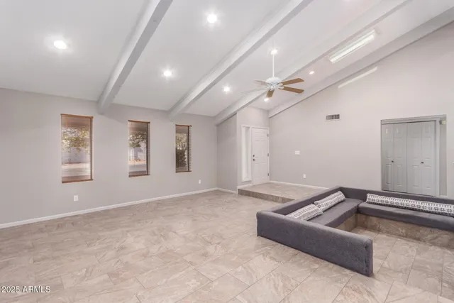 a living room with furniture and windows
