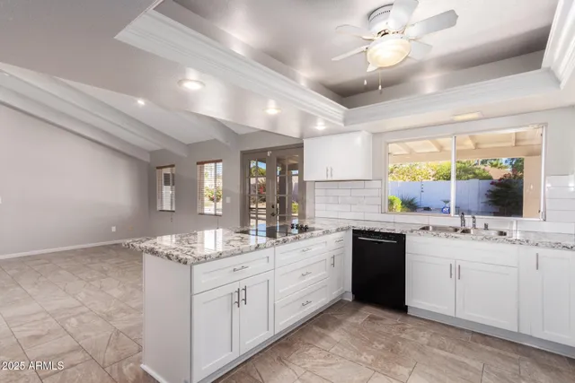 a kitchen with a sink stove and cabinets