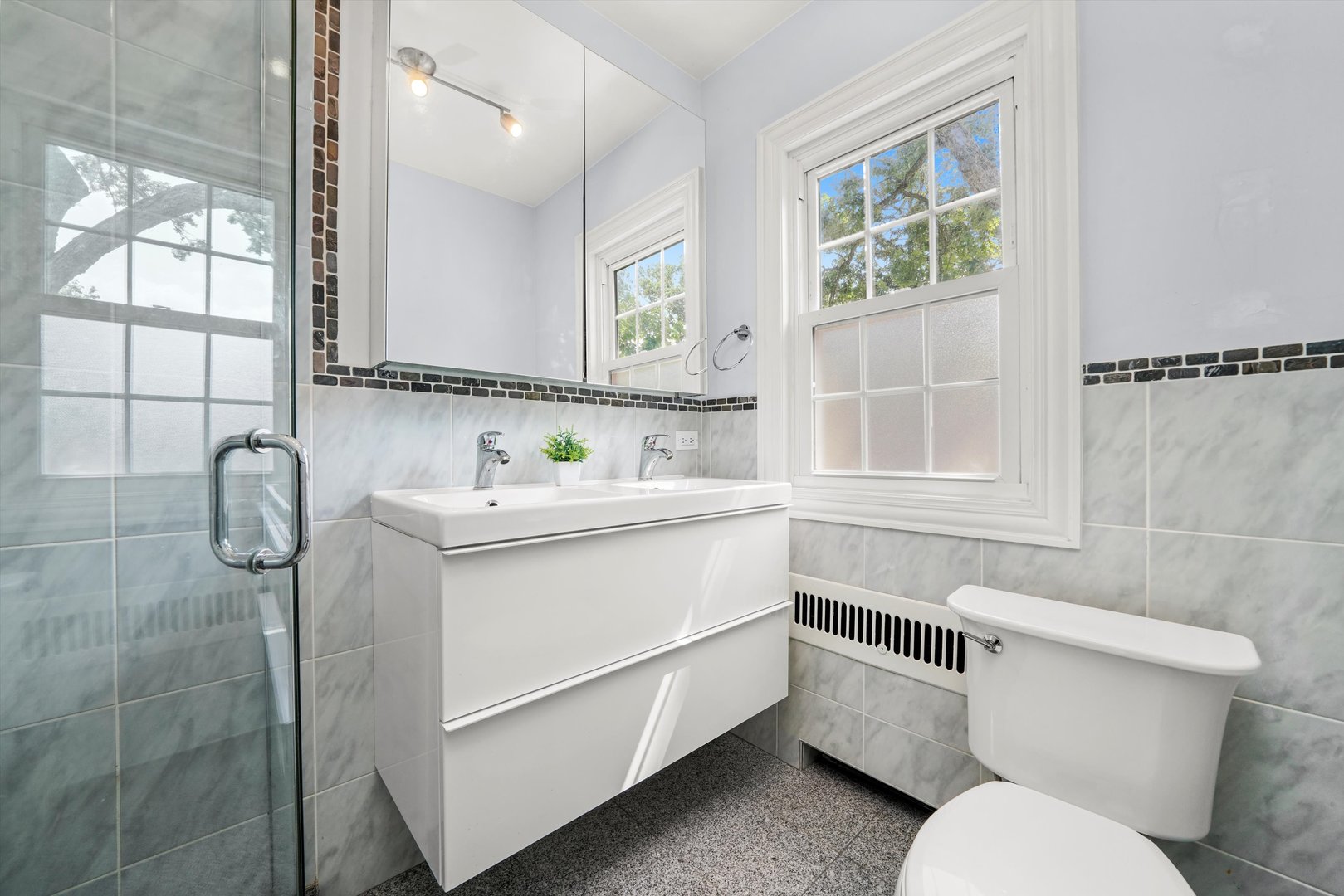 2108 Harrison Street Evanston, IL 60201 - Photo 18 of 44 a bathroom with a sink toilet and shower