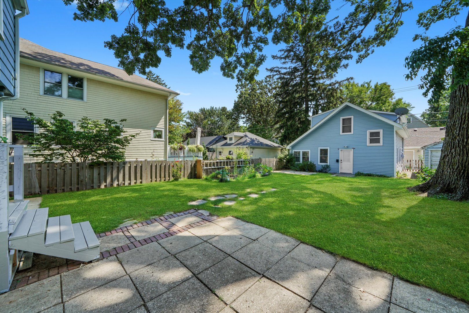 2108 Harrison Street Evanston, IL 60201 - Photo 26 of 44 a front view of house with a garden