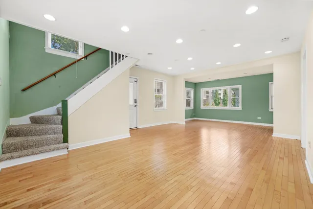 a kitchen with stainless steel appliances granite countertop a refrigerator and a stove top oven
