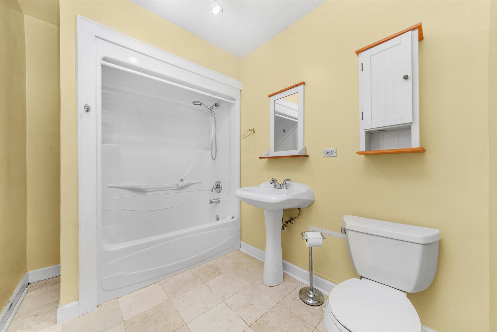 2108 Harrison Street Evanston, IL 60201 - Photo 32 of 44 a bathroom with a toilet sink and mirror