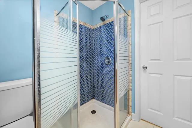 a utility room with a sink a vanity and a window