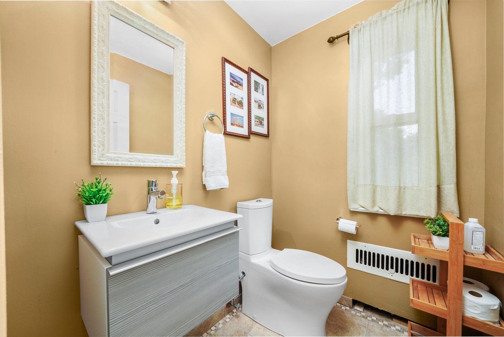 2108 Harrison Street Evanston, IL 60201 - Photo 10 of 44 a bathroom with a sink a toilet and a mirror