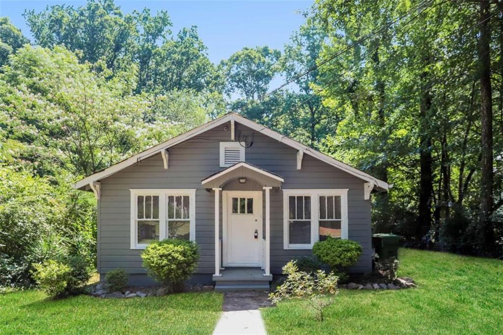 2540 Rex Avenue Southwest Atlanta, GA 30331 - Photo 1 of 1 a view of a house with a yard and potted plants