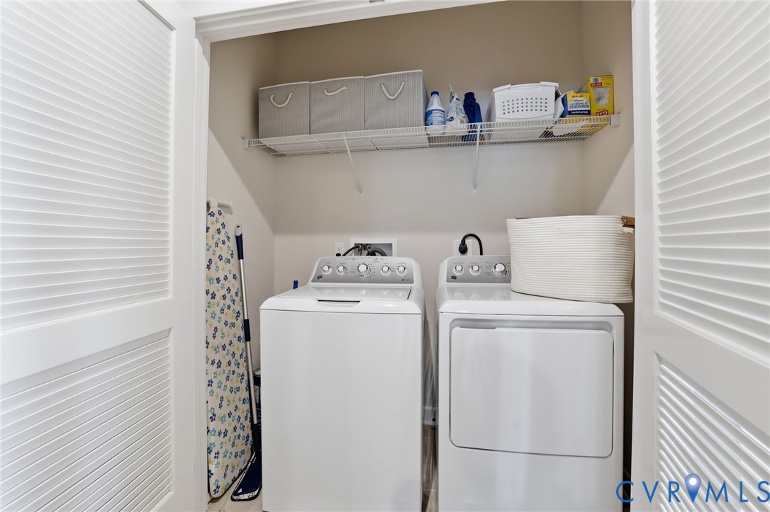 6635 Citory Way, Unit 306 Moseley, VA 23120 - Photo 12 of 16 a utility room with dryer and washer