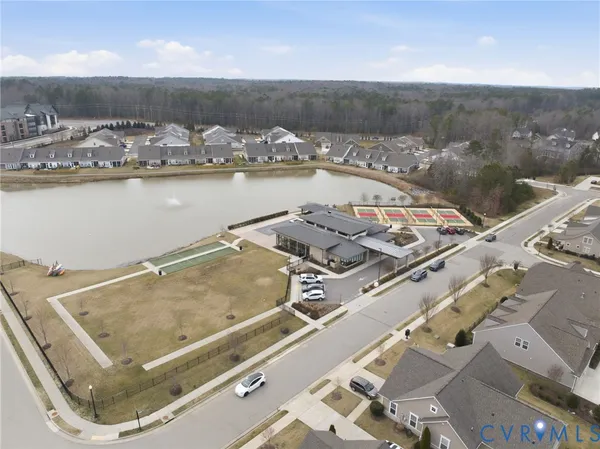 an aerial view of a house with a lake view