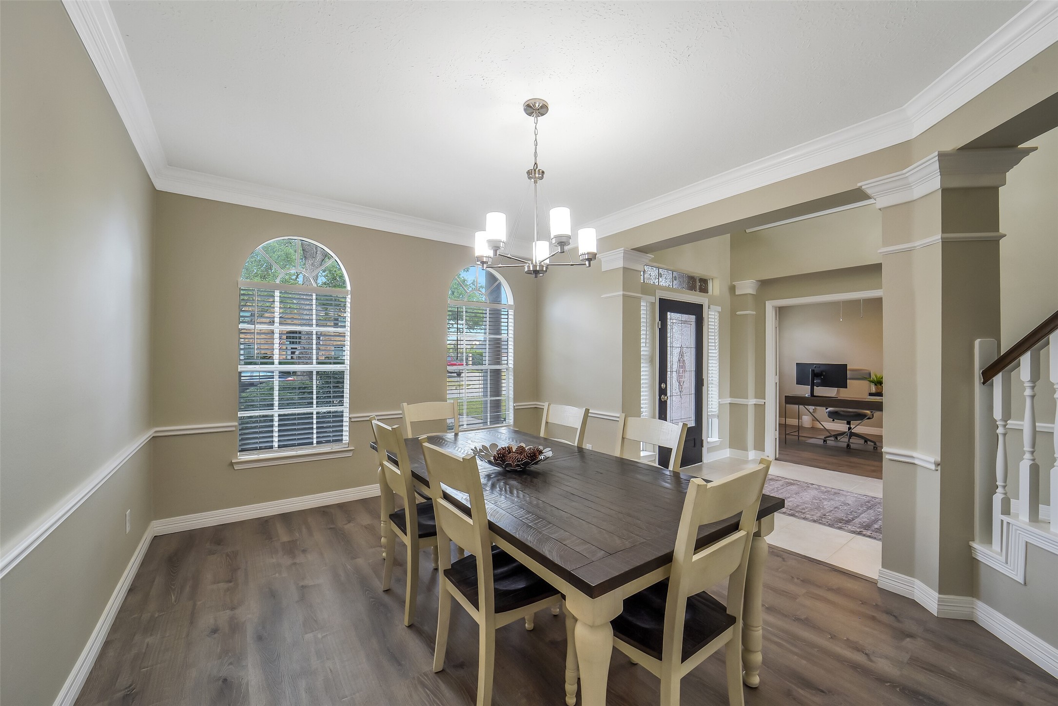 24403 Falcon Point Drive Katy, TX 77494 - Photo 8 of 32 Sophisticated formal dining room with arched architectural details and large windows that fill the space with natural light.