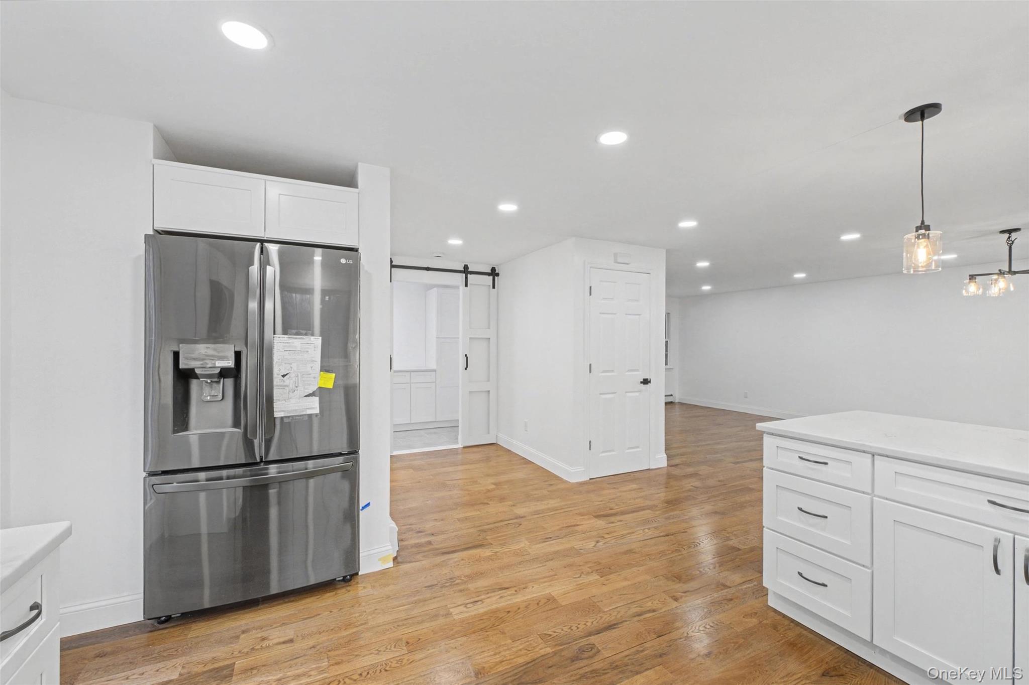16 Cold Spring Road Putnam Valley, NY 10579 - Photo 14 of 44 a kitchen with granite countertop a refrigerator and a sink