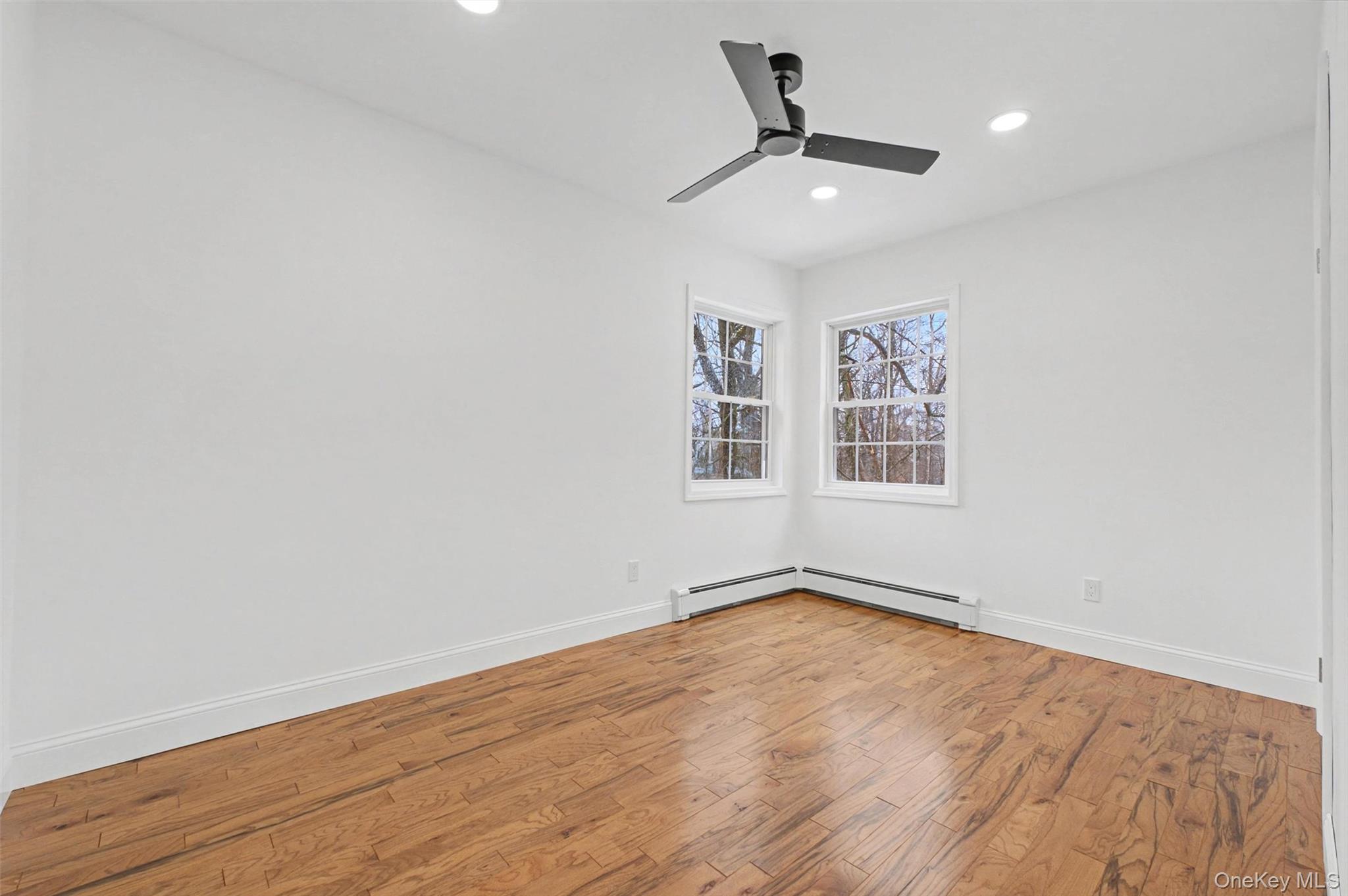 16 Cold Spring Road Putnam Valley, NY 10579 - Photo 19 of 44 a view of empty room with wooden floor and fan