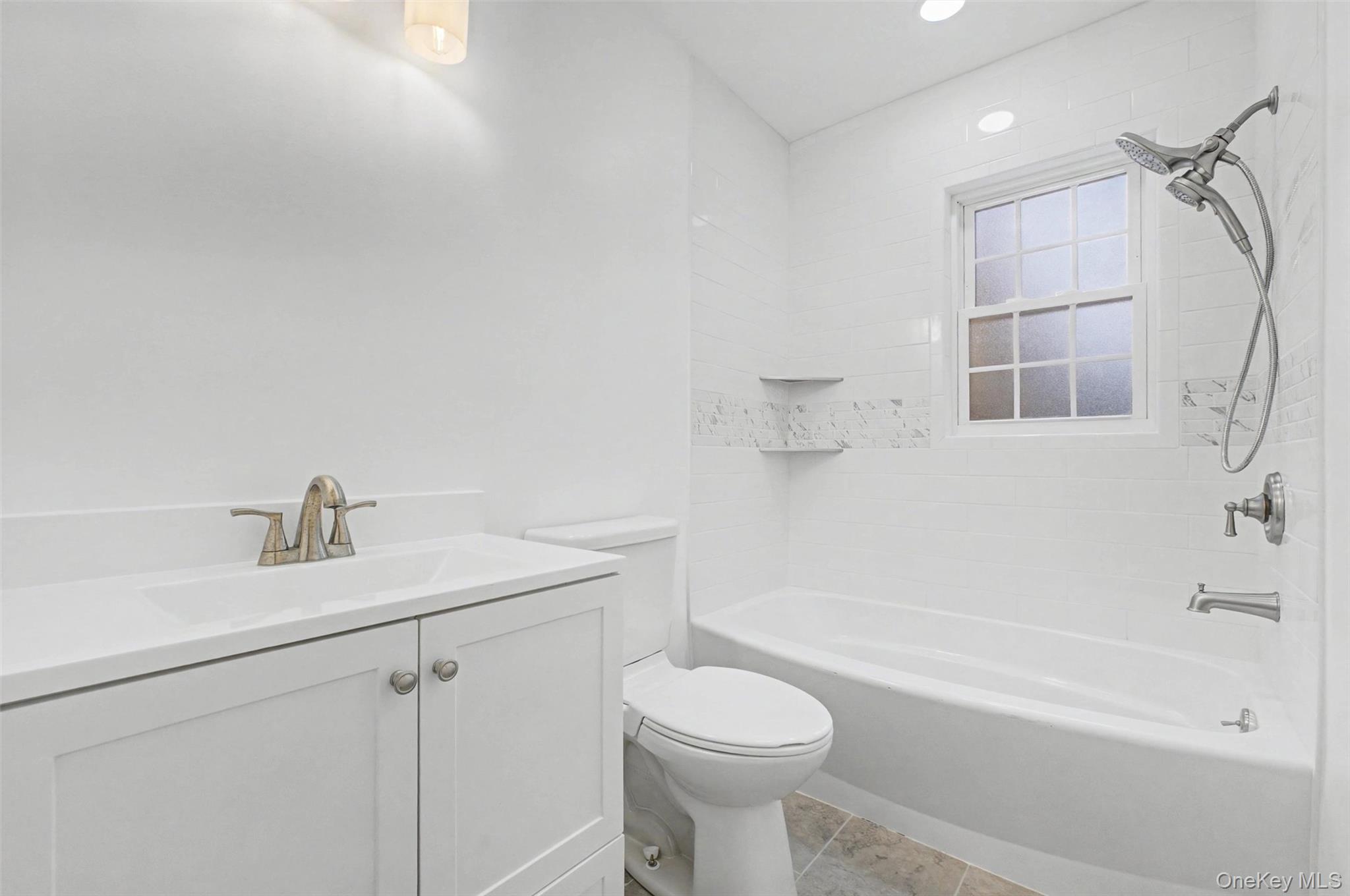 16 Cold Spring Road Putnam Valley, NY 10579 - Photo 20 of 44 a bathroom with a sink a toilet and a bathtub