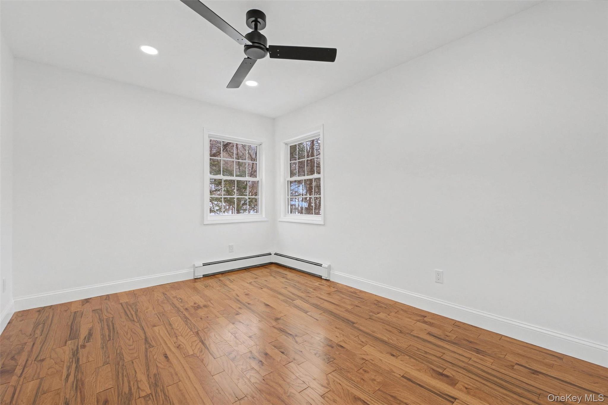 16 Cold Spring Road Putnam Valley, NY 10579 - Photo 21 of 44 a view of empty room with wooden floor and fan