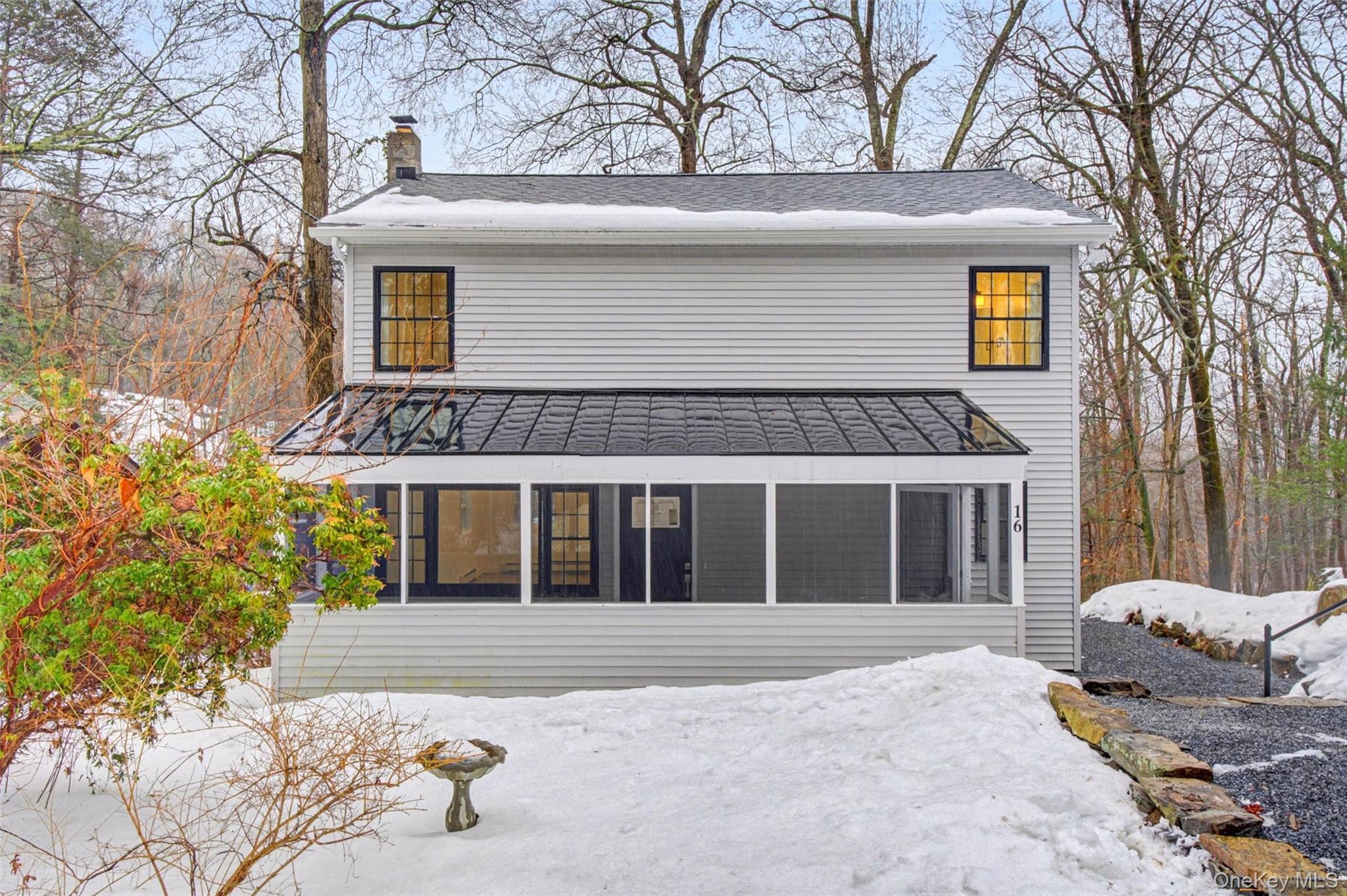 16 Cold Spring Road Putnam Valley, NY 10579 - Photo 32 of 44 a front view of a house with a yard and garage