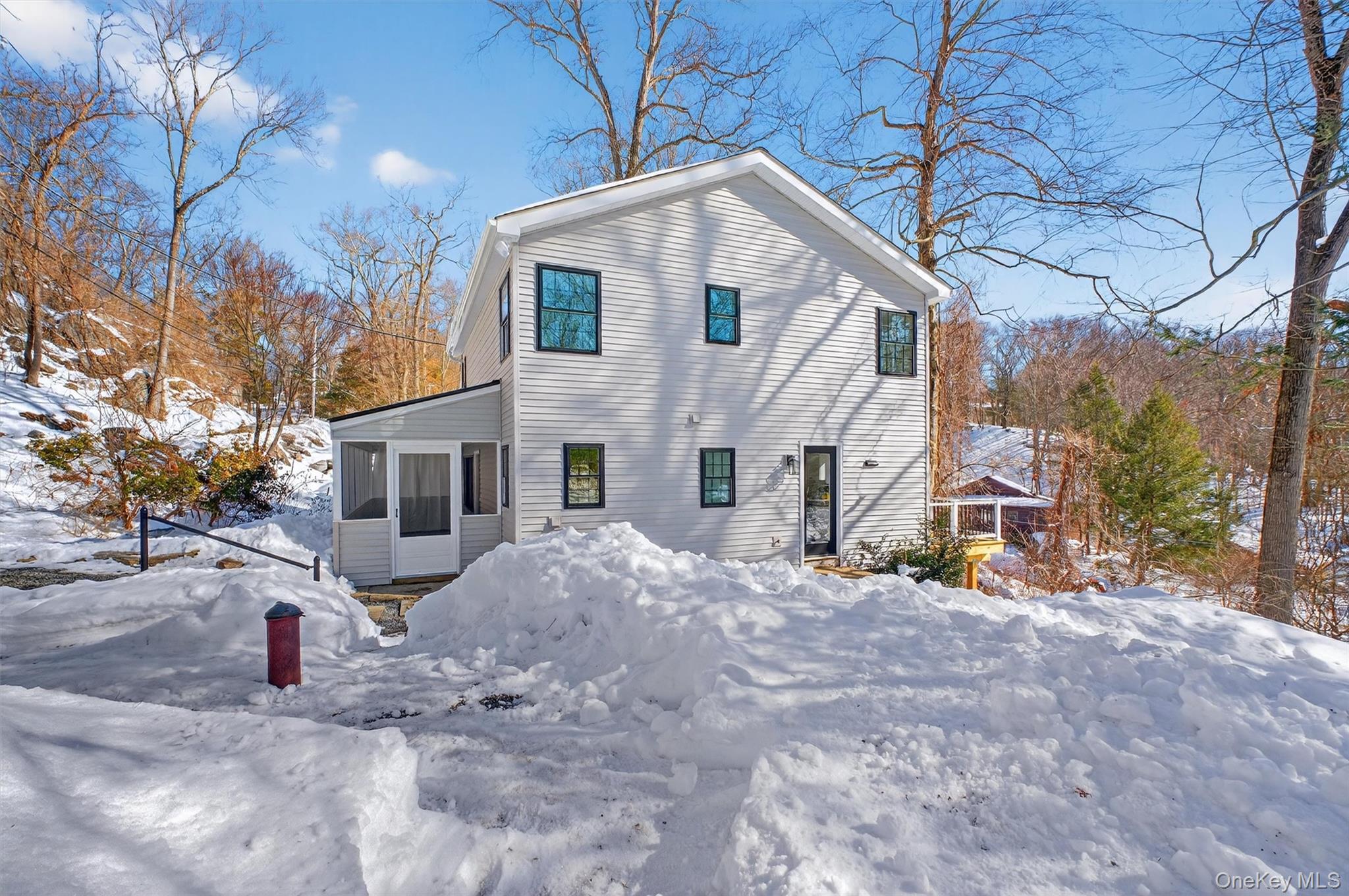 16 Cold Spring Road Putnam Valley, NY 10579 - Photo 33 of 44 a view of a white house with a yard