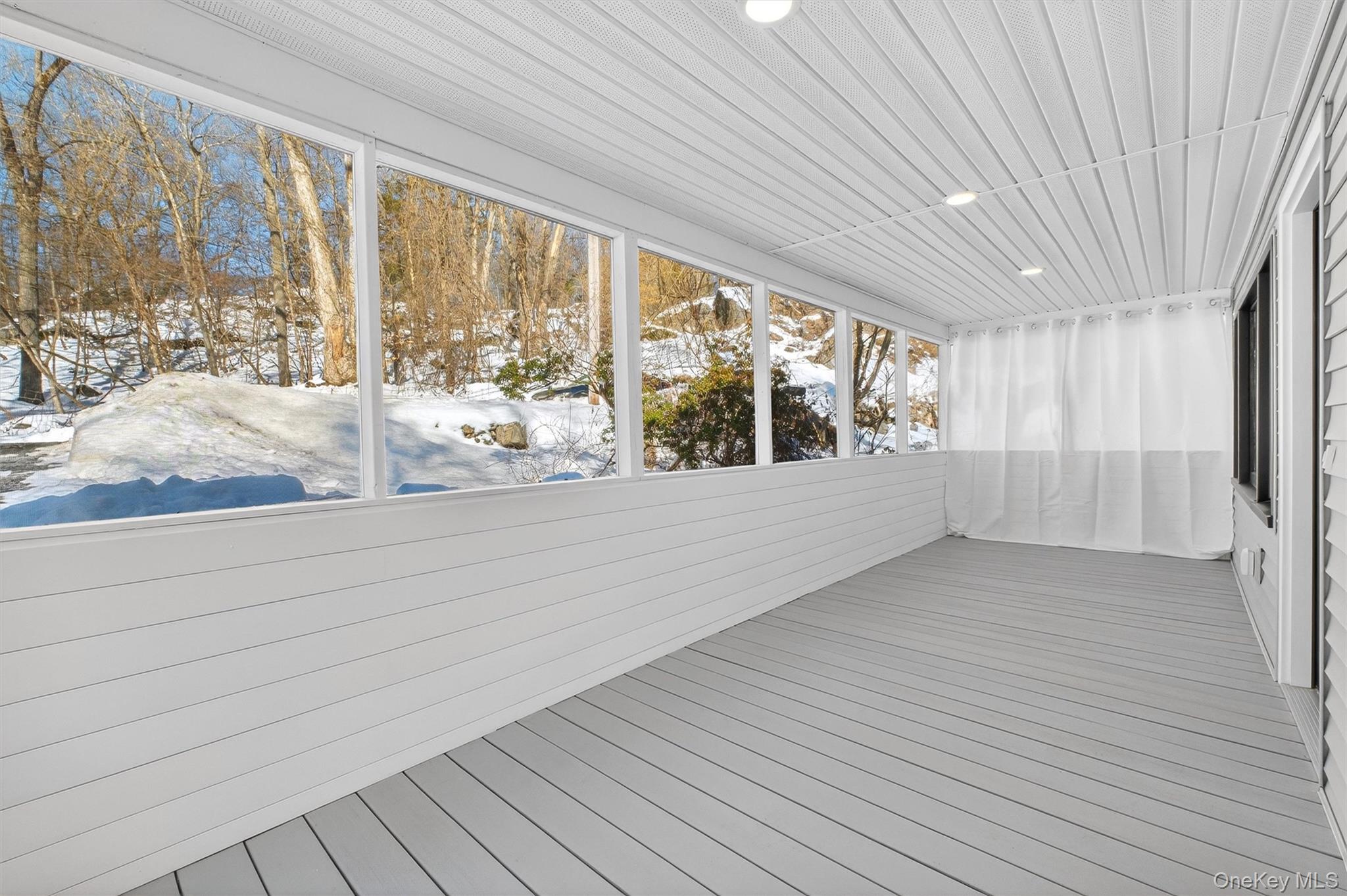 16 Cold Spring Road Putnam Valley, NY 10579 - Photo 4 of 44 a view of wooden floor and windows in a room