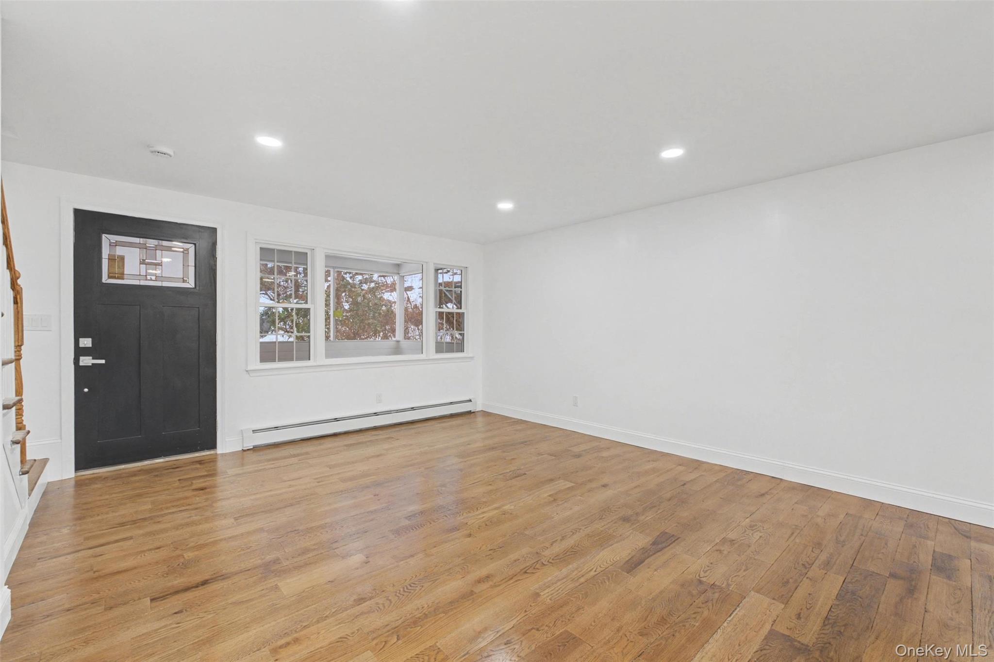 16 Cold Spring Road Putnam Valley, NY 10579 - Photo 5 of 44 a view of empty room with wooden floor and fan