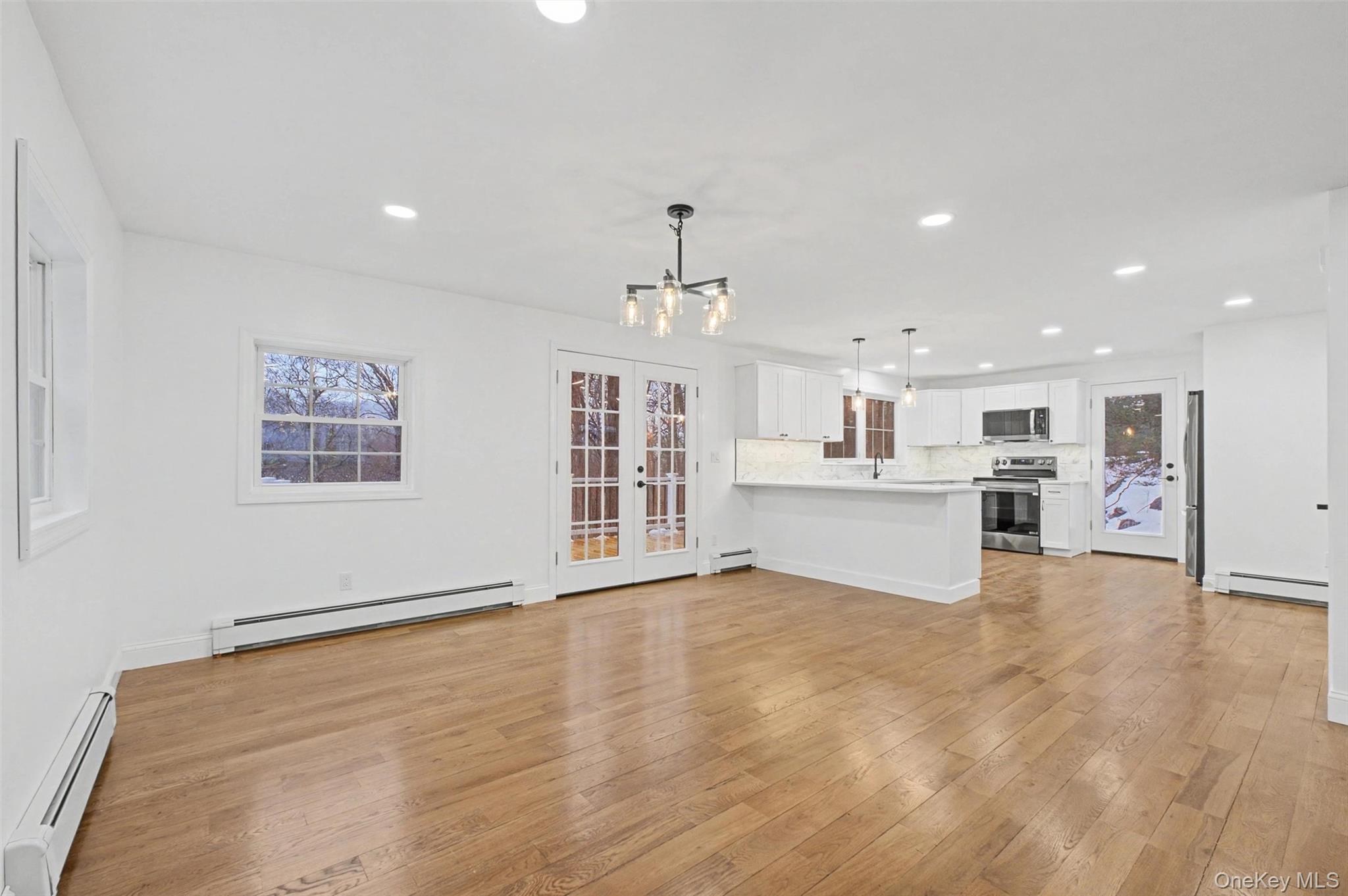 16 Cold Spring Road Putnam Valley, NY 10579 - Photo 9 of 44 a view of an empty room with kitchen and window
