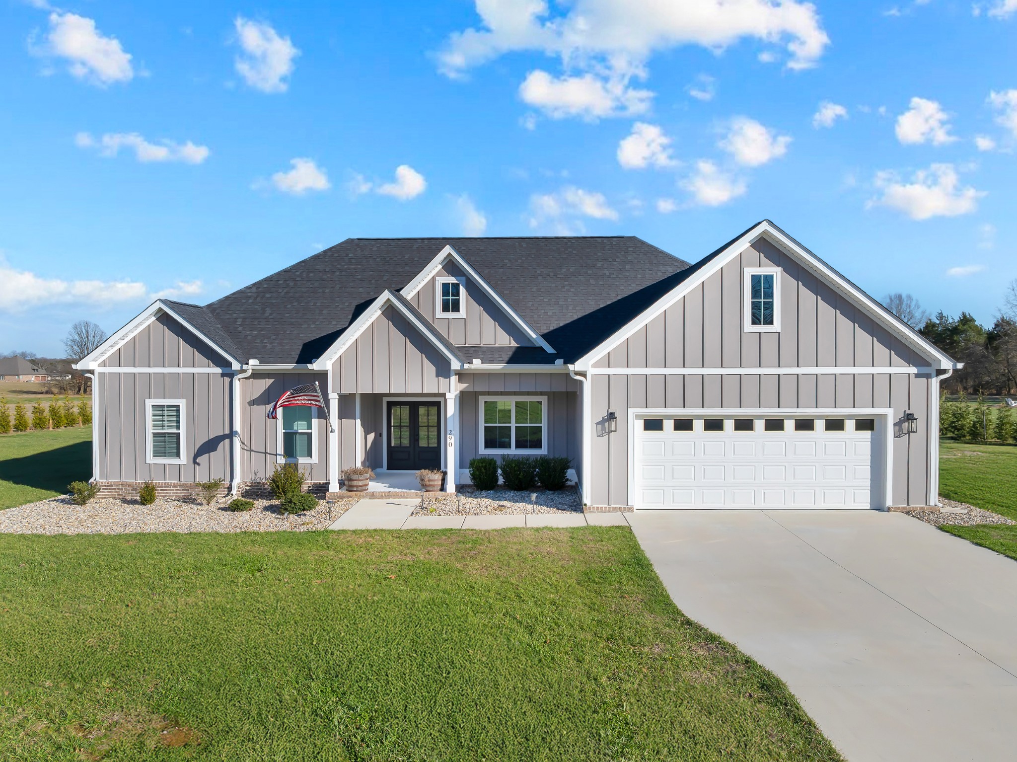 a front view of a house with a yard