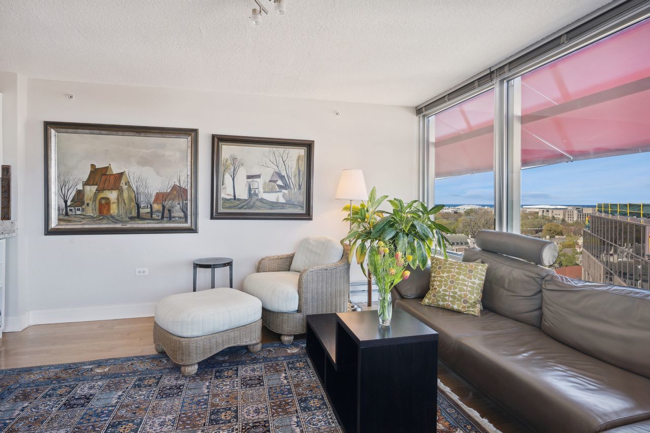 800 Elgin Road, Unit 1419 Evanston, IL 60201 - Photo 12 of 28 a living room with furniture and a potted plant