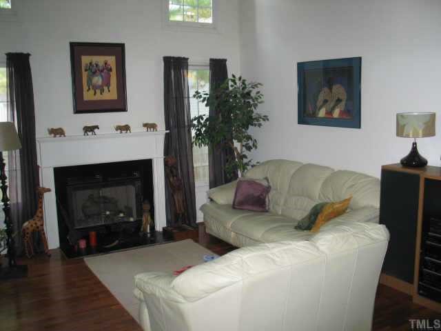 5409 Pennfine Drive Raleigh, NC 27610 - Photo 4 of 10 a living room with furniture and a fireplace