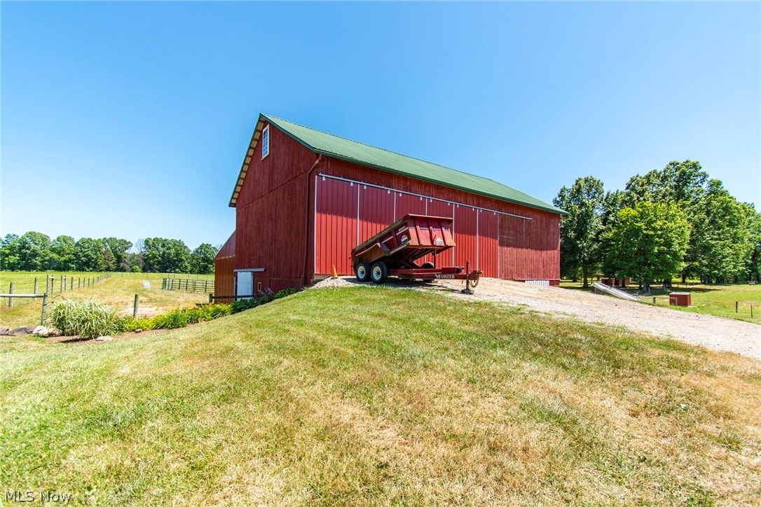 11711 Bandy Road Alliance, OH 44601 - Photo 11 of 50 View of outdoor structure featuring a lawn and a rural view