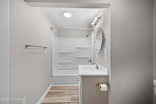 a bathroom with a sink and mirror