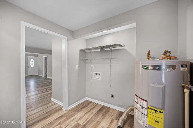 a view of hallway with wooden floor