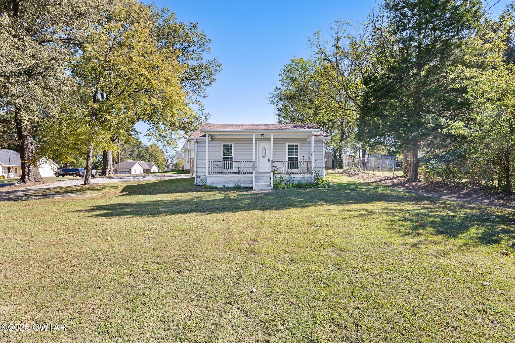 462 Mifflin Avenue Henderson, TN 38340 - Photo 2 of 18 a house view with swimming pool in front of it