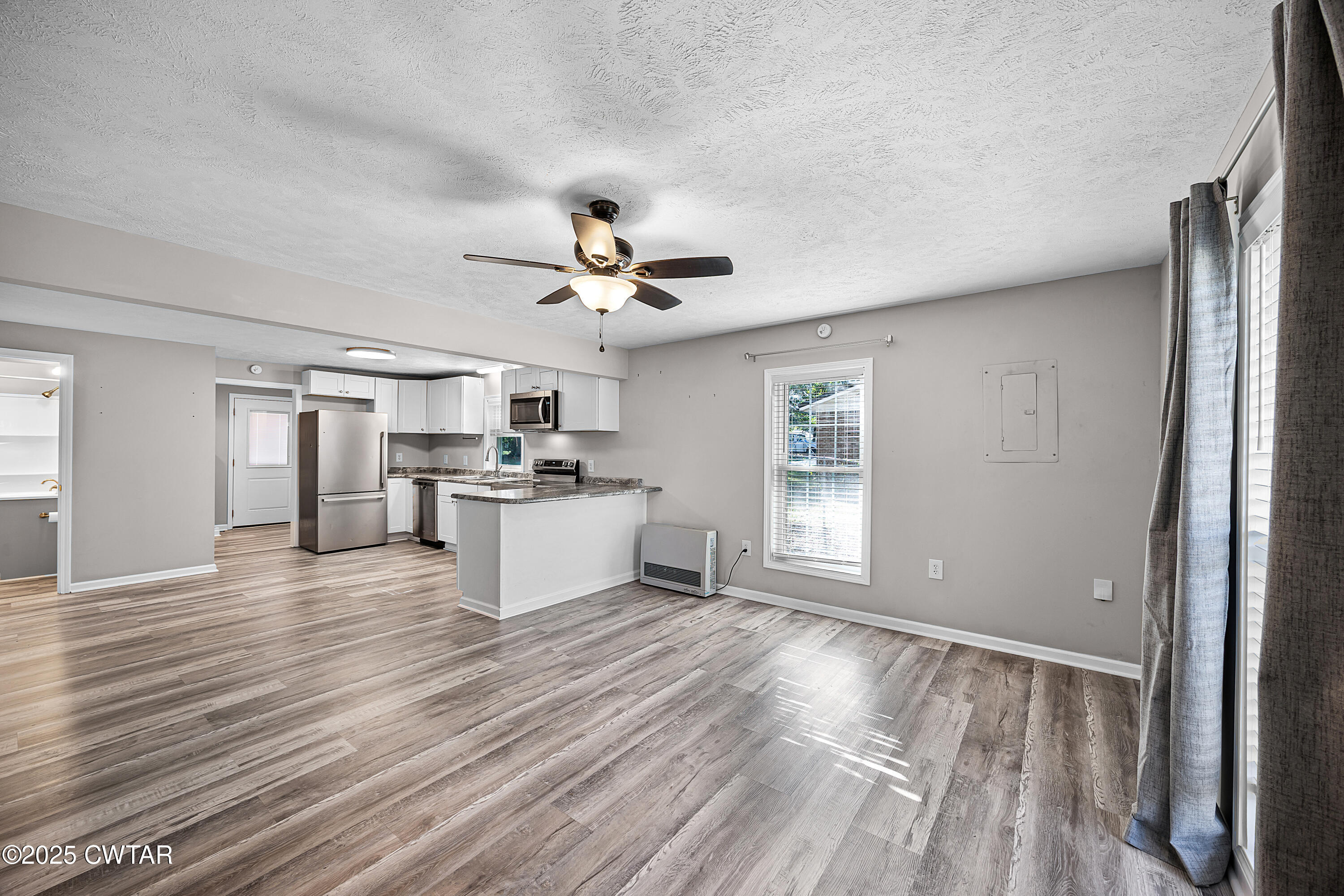462 Mifflin Avenue Henderson, TN 38340 - Photo 4 of 18 a view of kitchen with cabinets and wooden floor