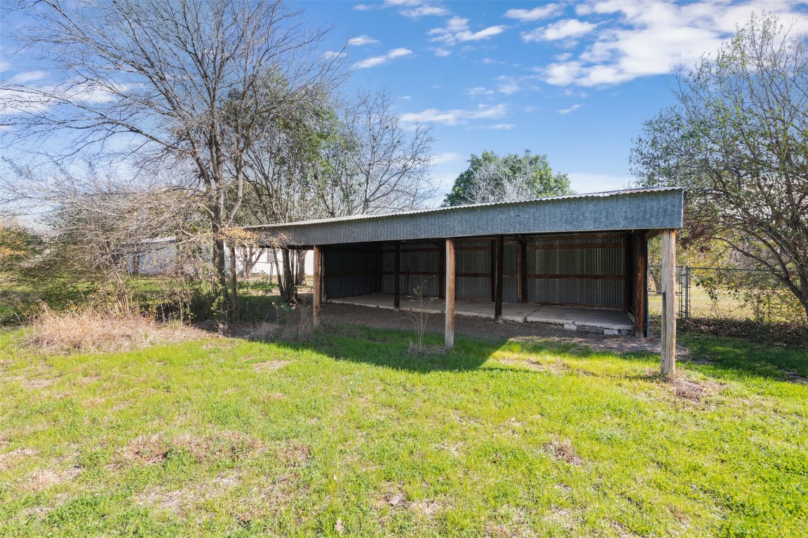 4806 Pecan Springs Road Austin, TX 78723 - Photo 12 of 20 a view of a house with a yard and garage