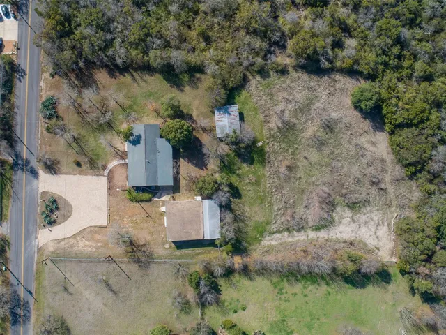 a aerial view of a houses with outdoor space