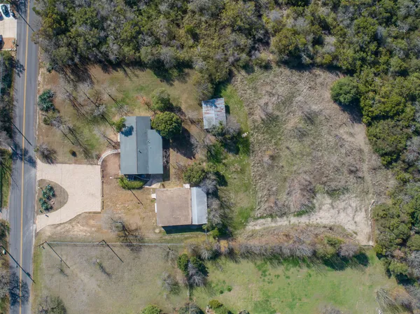 a aerial view of a houses with outdoor space