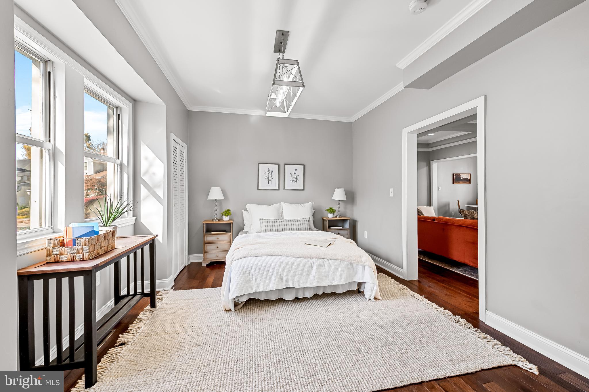 709 Cedarcroft Road Baltimore, MD 21212 - Photo 20 of 38 a spacious bedroom with a bed and a window