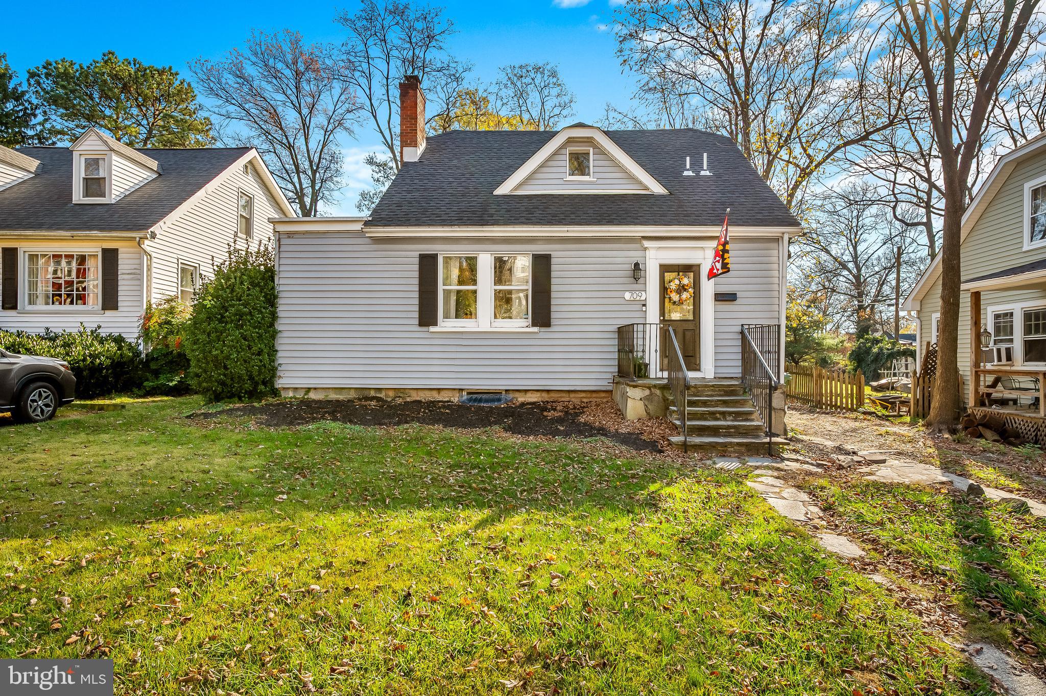 709 Cedarcroft Road Baltimore, MD 21212 - Photo 2 of 38 a front view of a house with a yard