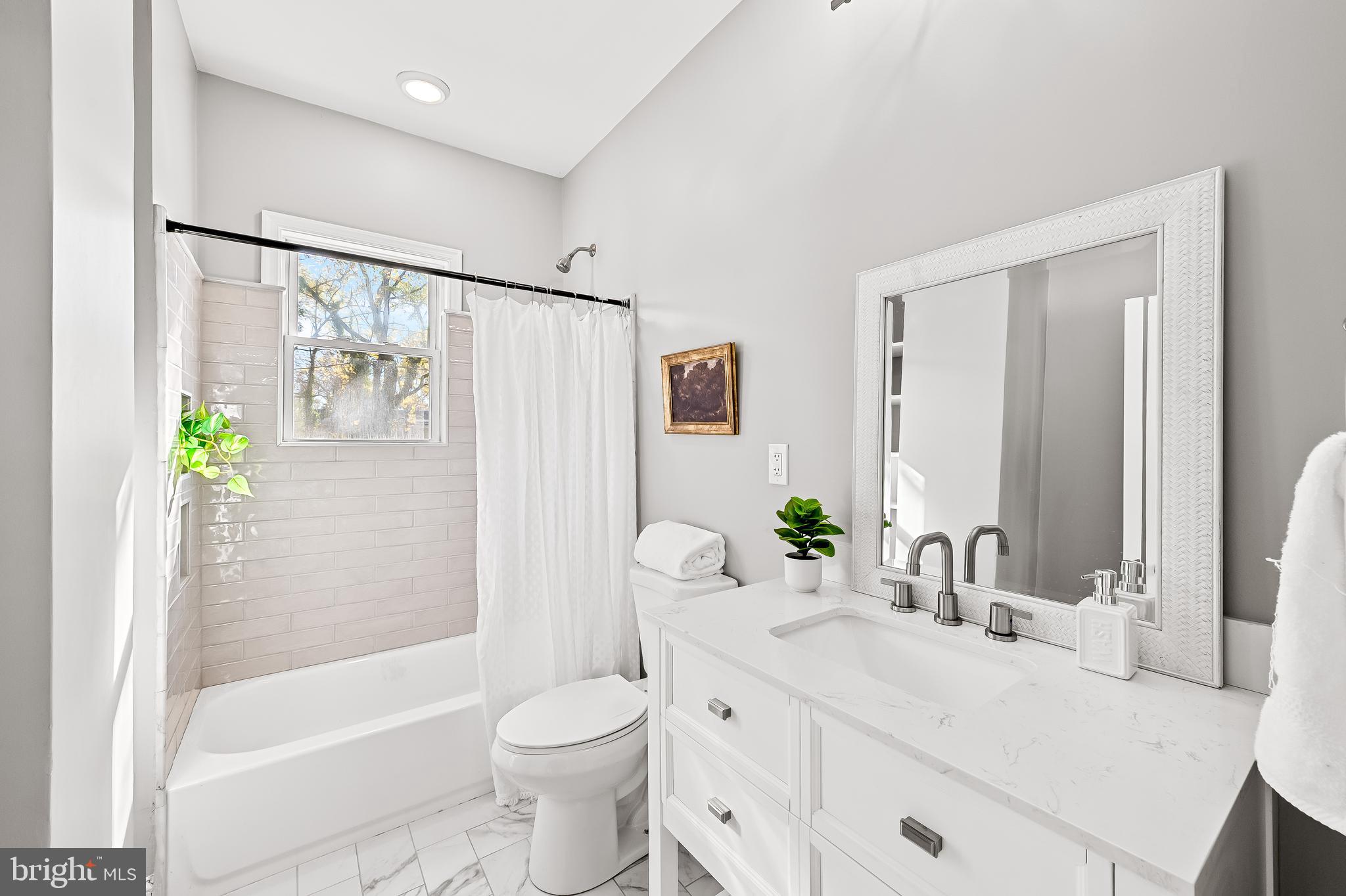 709 Cedarcroft Road Baltimore, MD 21212 - Photo 22 of 38 a bathroom with a sink toilet and shower