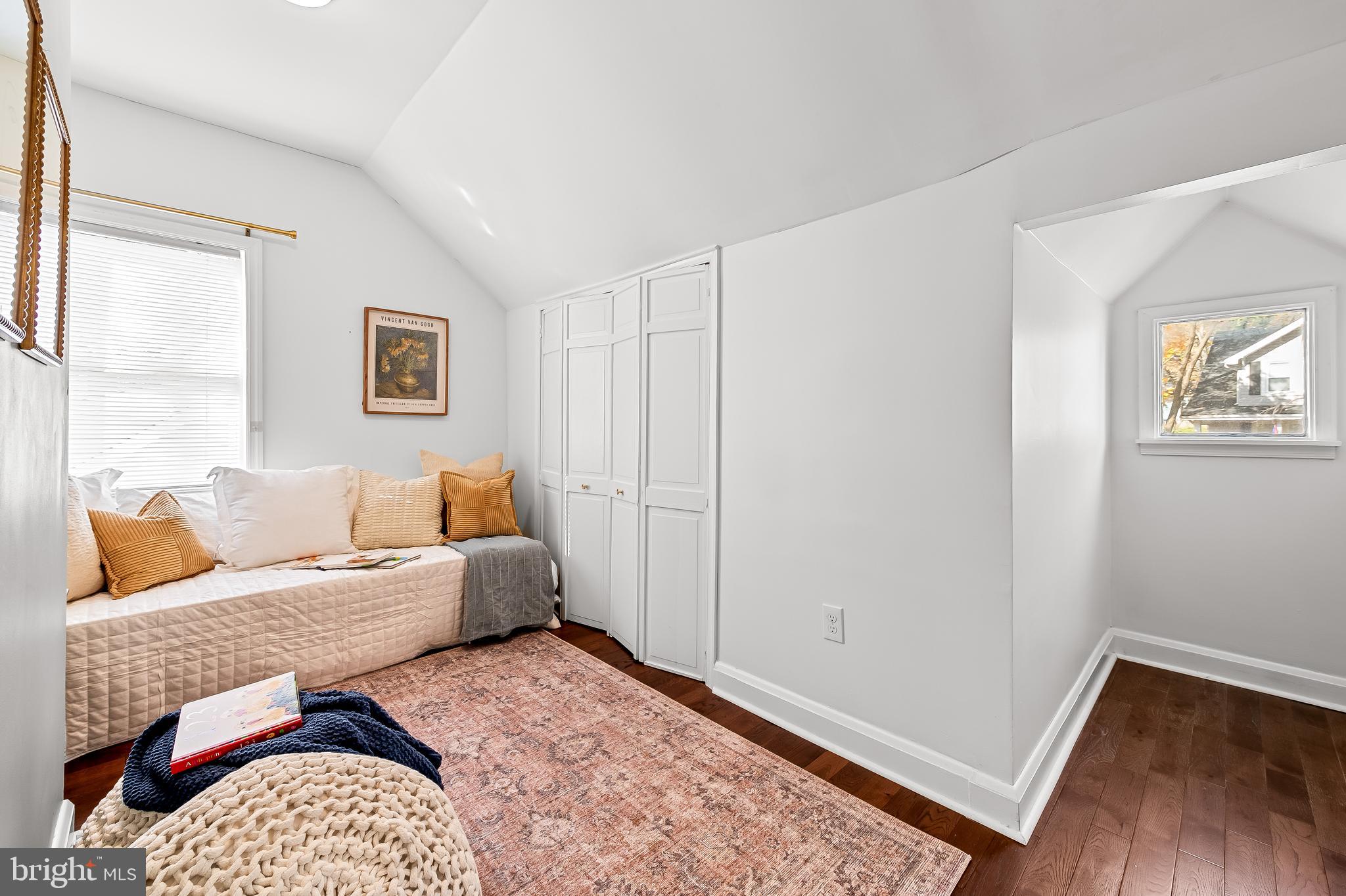 709 Cedarcroft Road Baltimore, MD 21212 - Photo 23 of 38 a bedroom with a bed and wooden floor