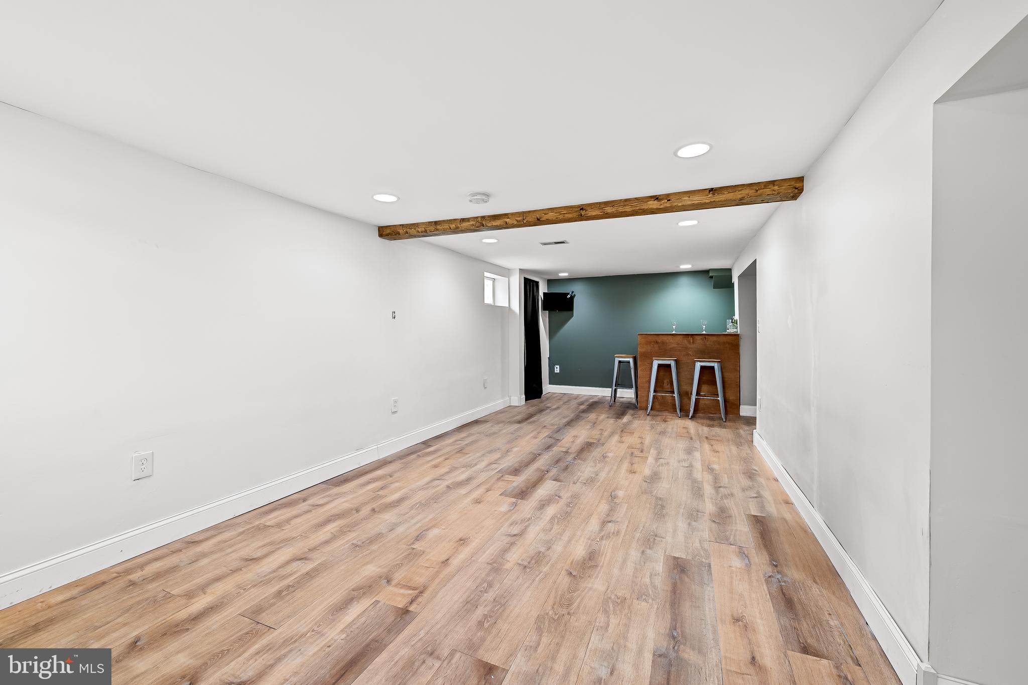 709 Cedarcroft Road Baltimore, MD 21212 - Photo 31 of 38 a view of a livingroom with a staircase