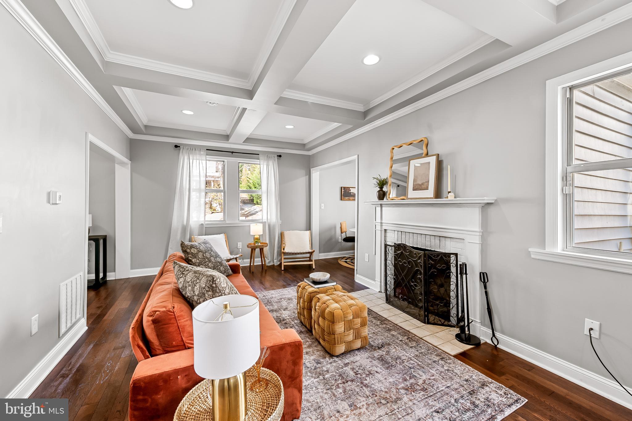 709 Cedarcroft Road Baltimore, MD 21212 - Photo 6 of 38 a living room with furniture and a fireplace